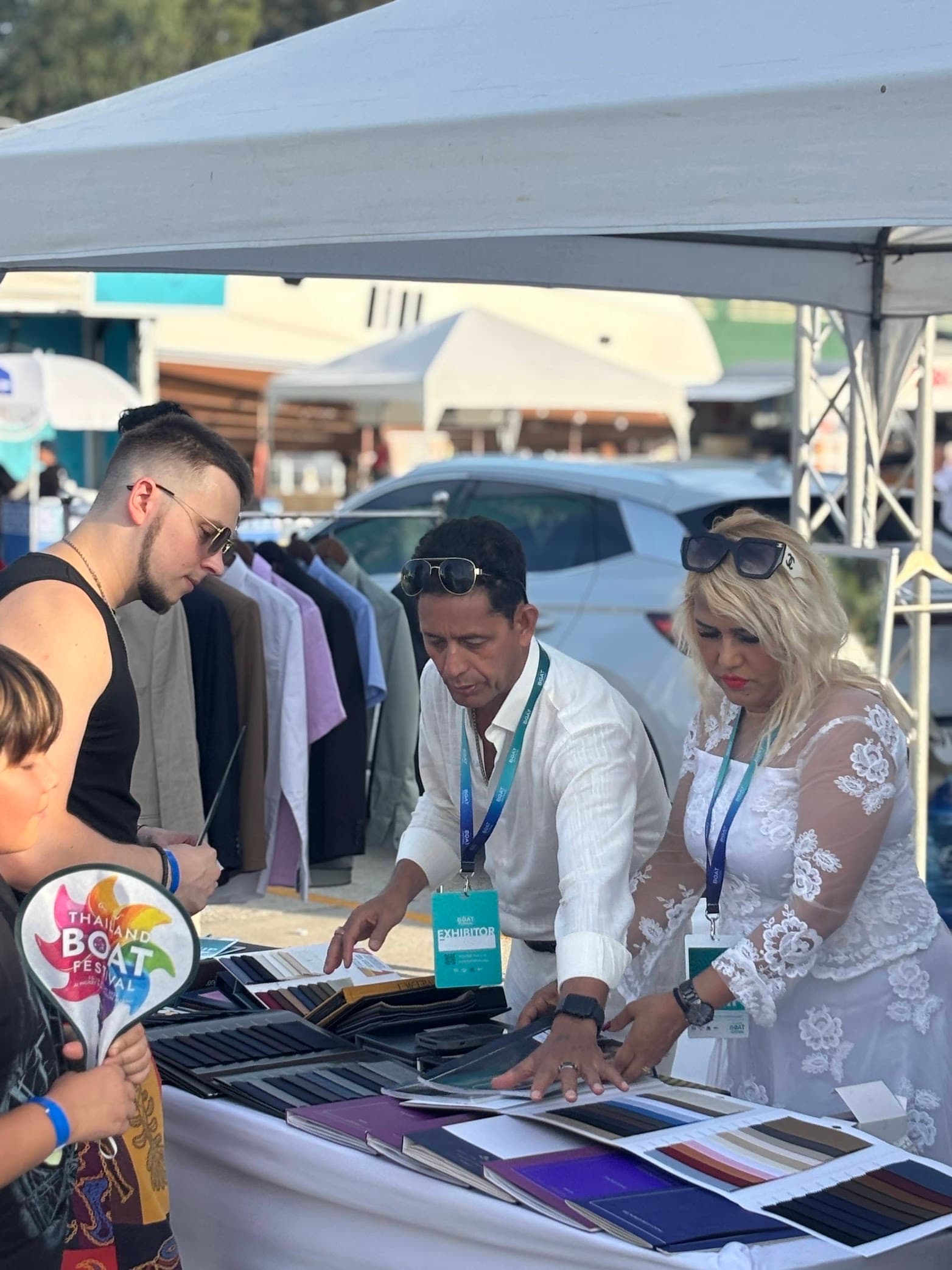 Kenny and Gita presenting fabric choices at a Phuket event