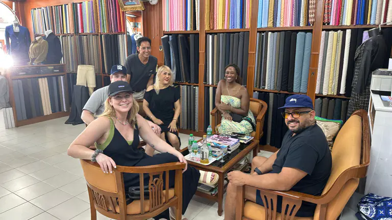 Clients relaxing in the Kenny & Gita Tailor fabric showroom in Kata, Phuket