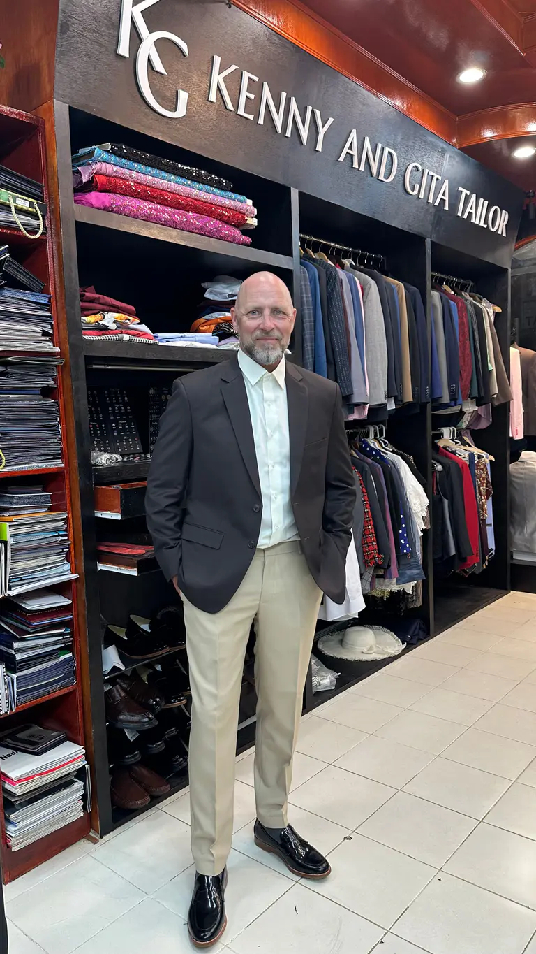 Client styled in a dark blazer and light trousers at Kenny & Gita Tailor in Phuket